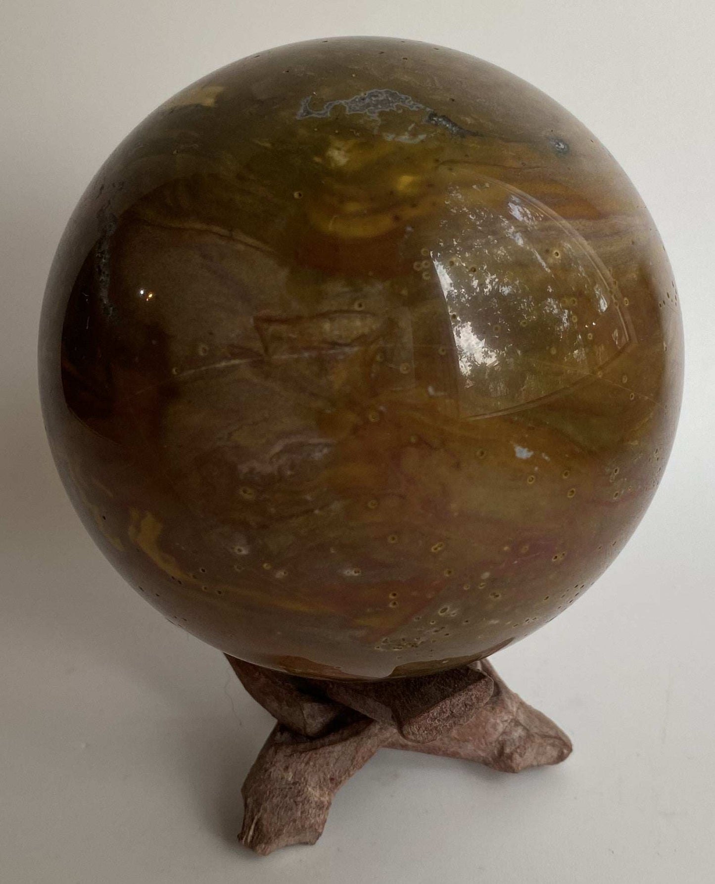 Jasp Oceanic semi-precious stone sphere on wooden stand