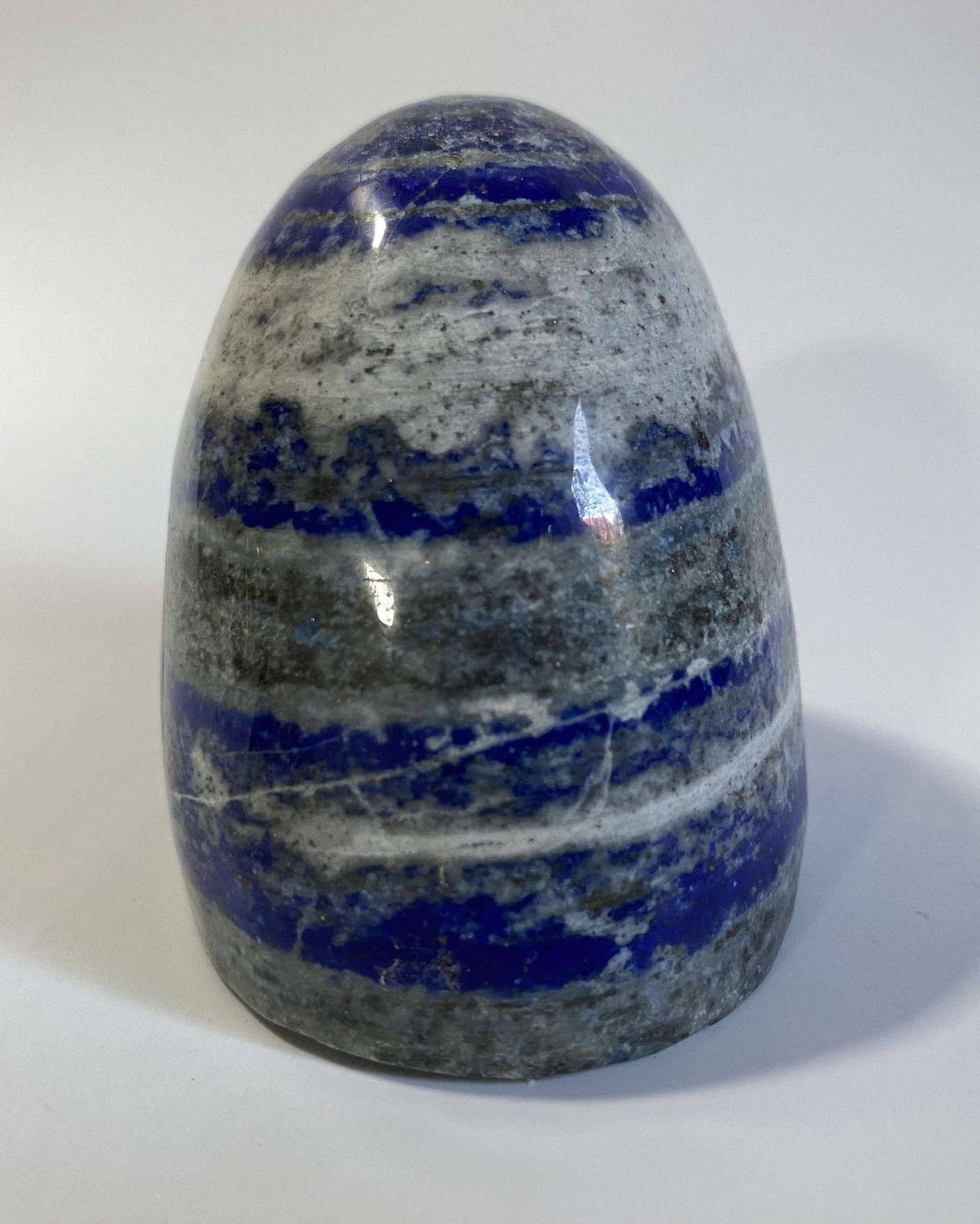 Lapis Lazuli polished sculpture with blue and gray bands semi-precious stone