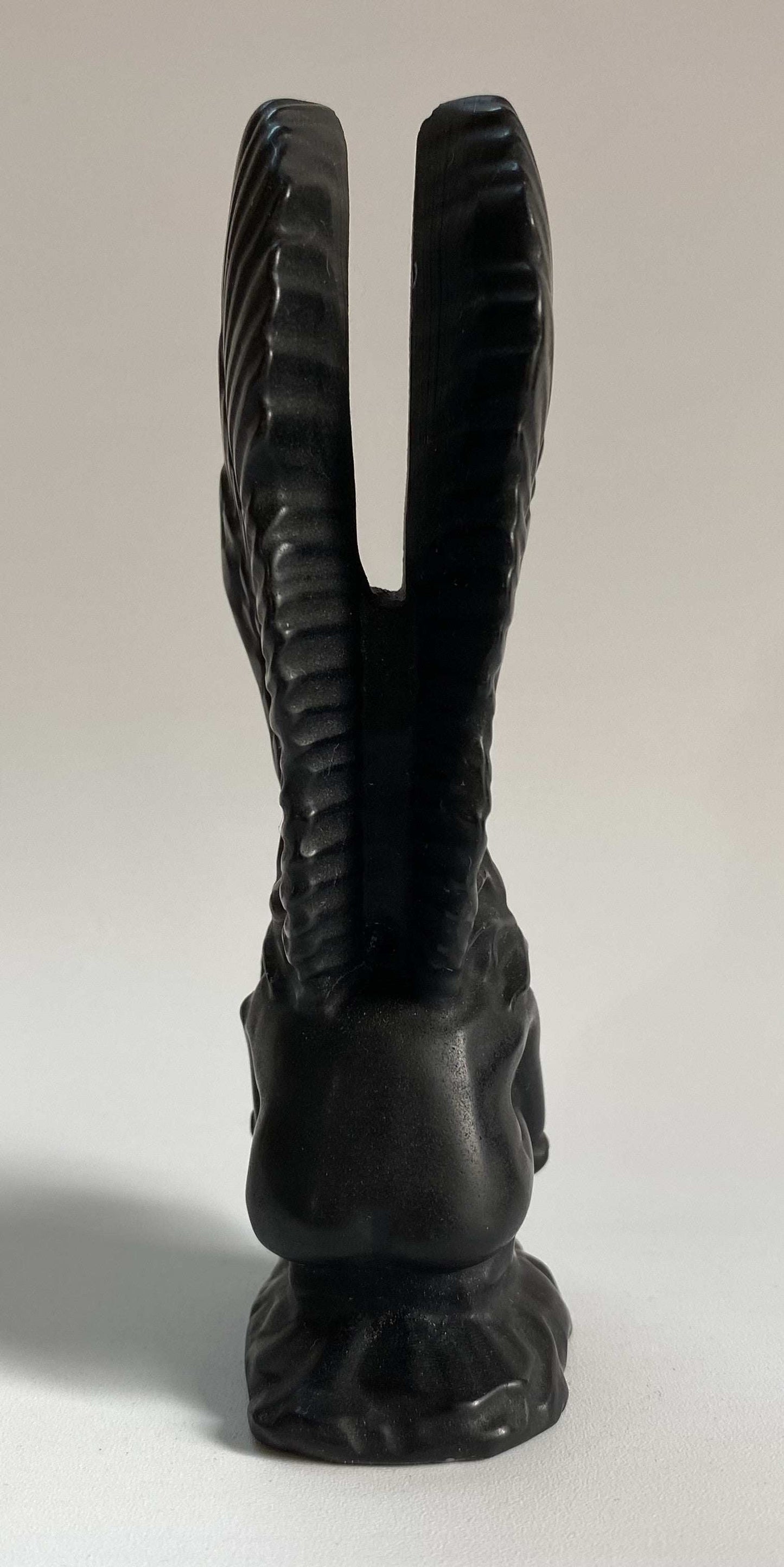 Carved obsidian angel figurine sculpture with detailed wings and base