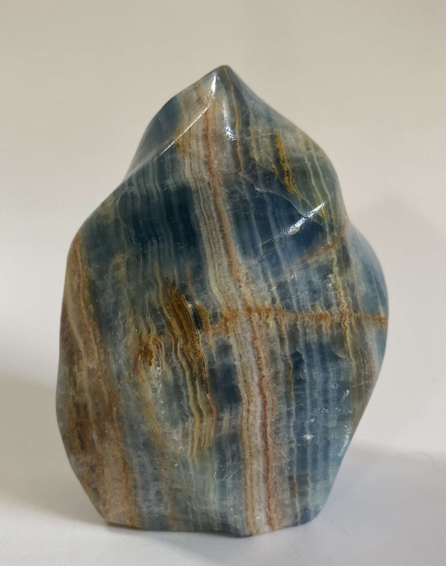 Onix Albastru sculpted semiprecious stone sculpture with blue and brown stripes