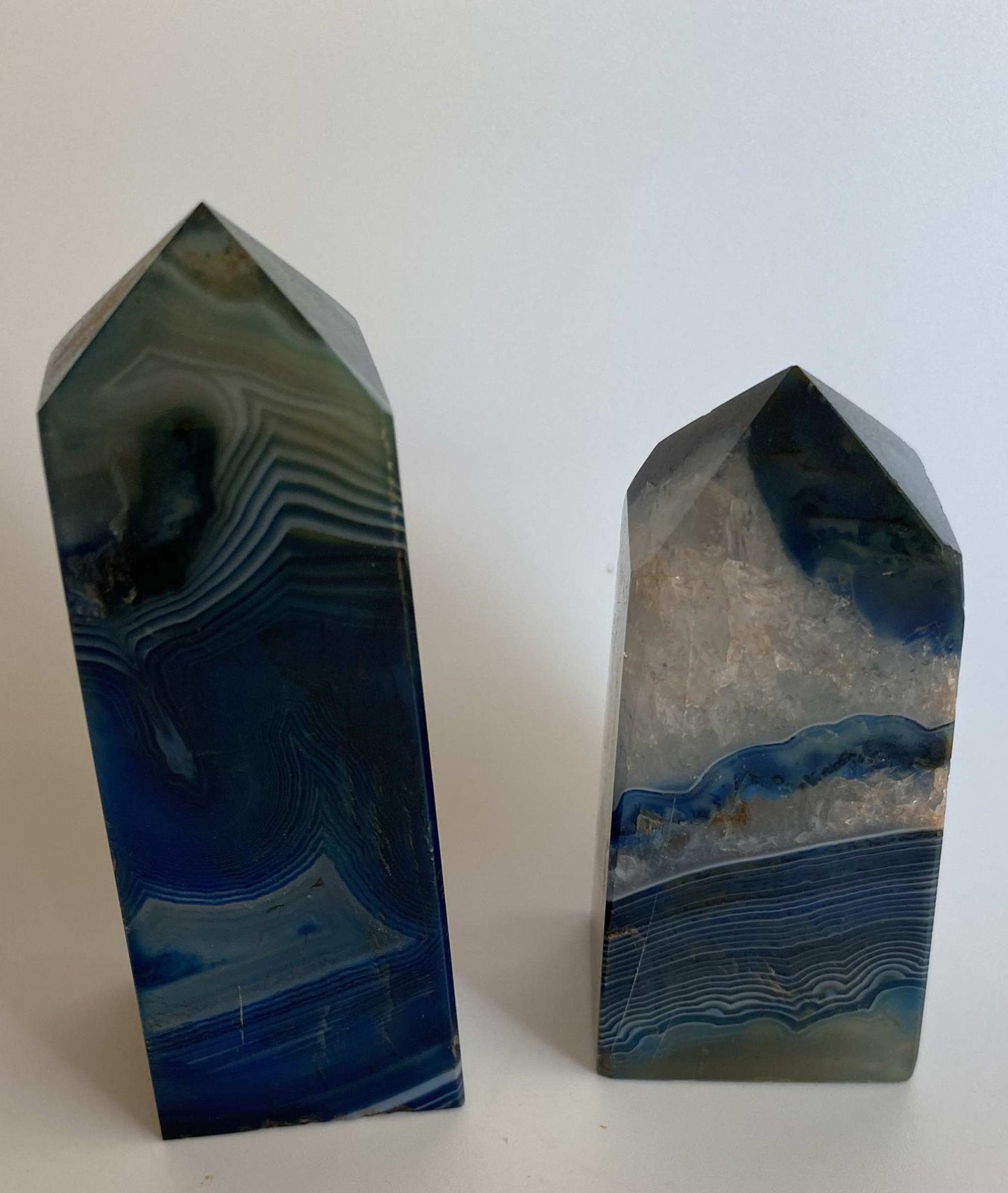 Set of two blue agate obelisks semi-precious stones with natural banding patterns