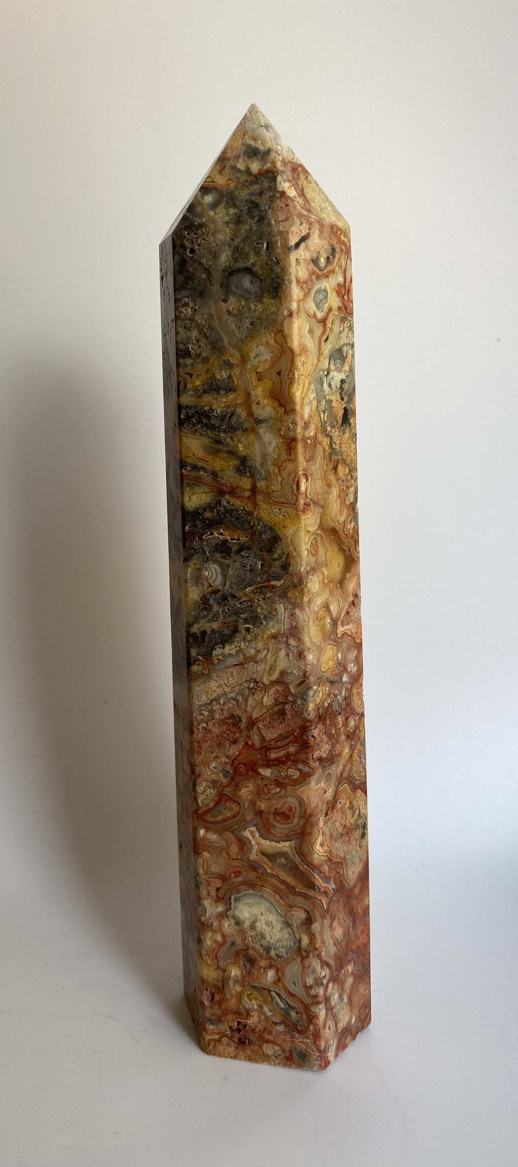 Obelisk made of Agat Crazy Lace semi-precious stone with intricate natural patterns