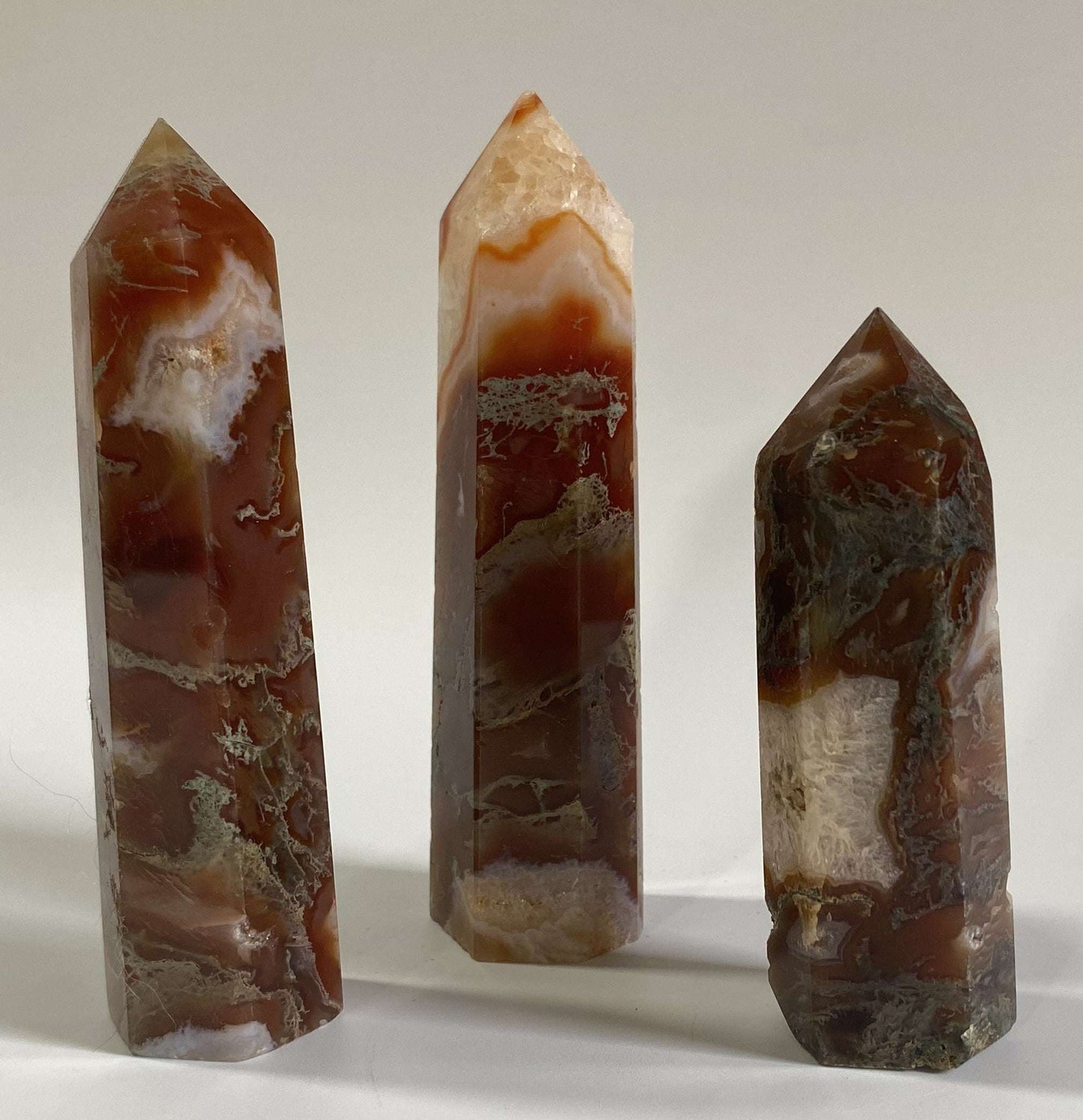 Set of three red moss agate obelisks semiprecious stones