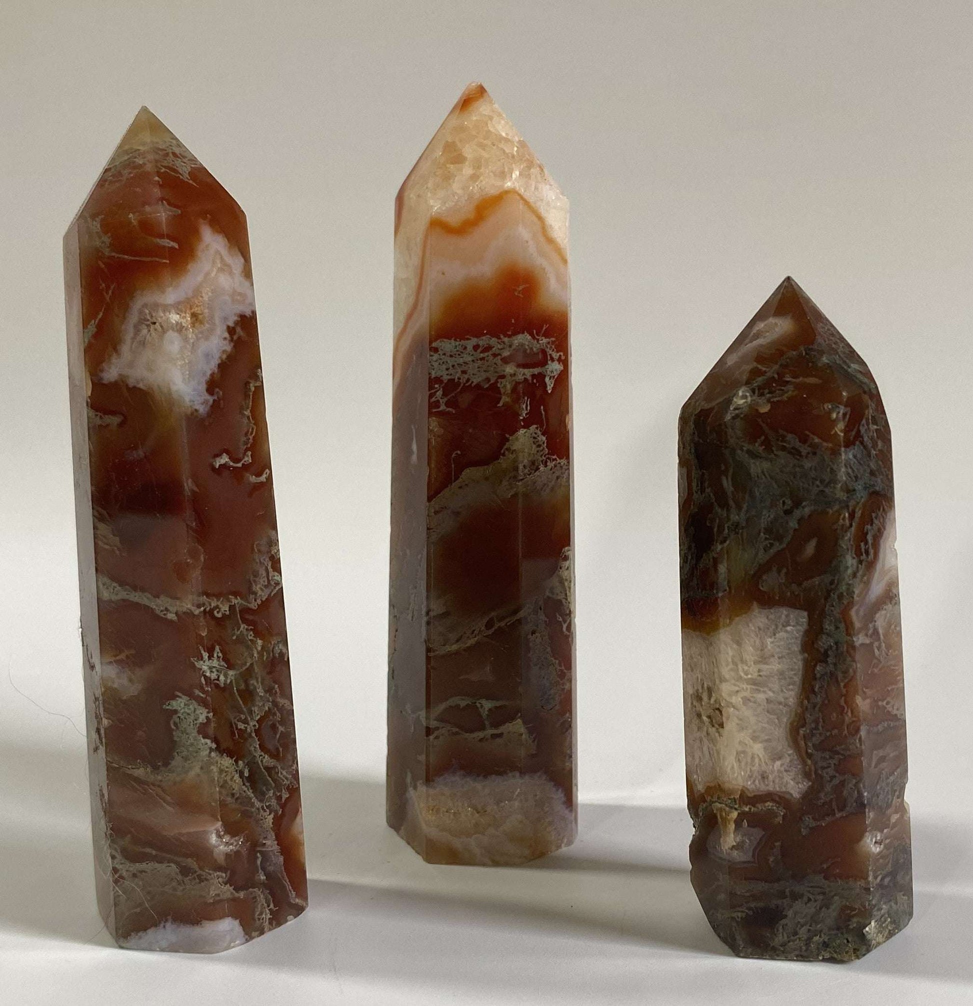 Set of three red moss agate obelisks semiprecious stones
