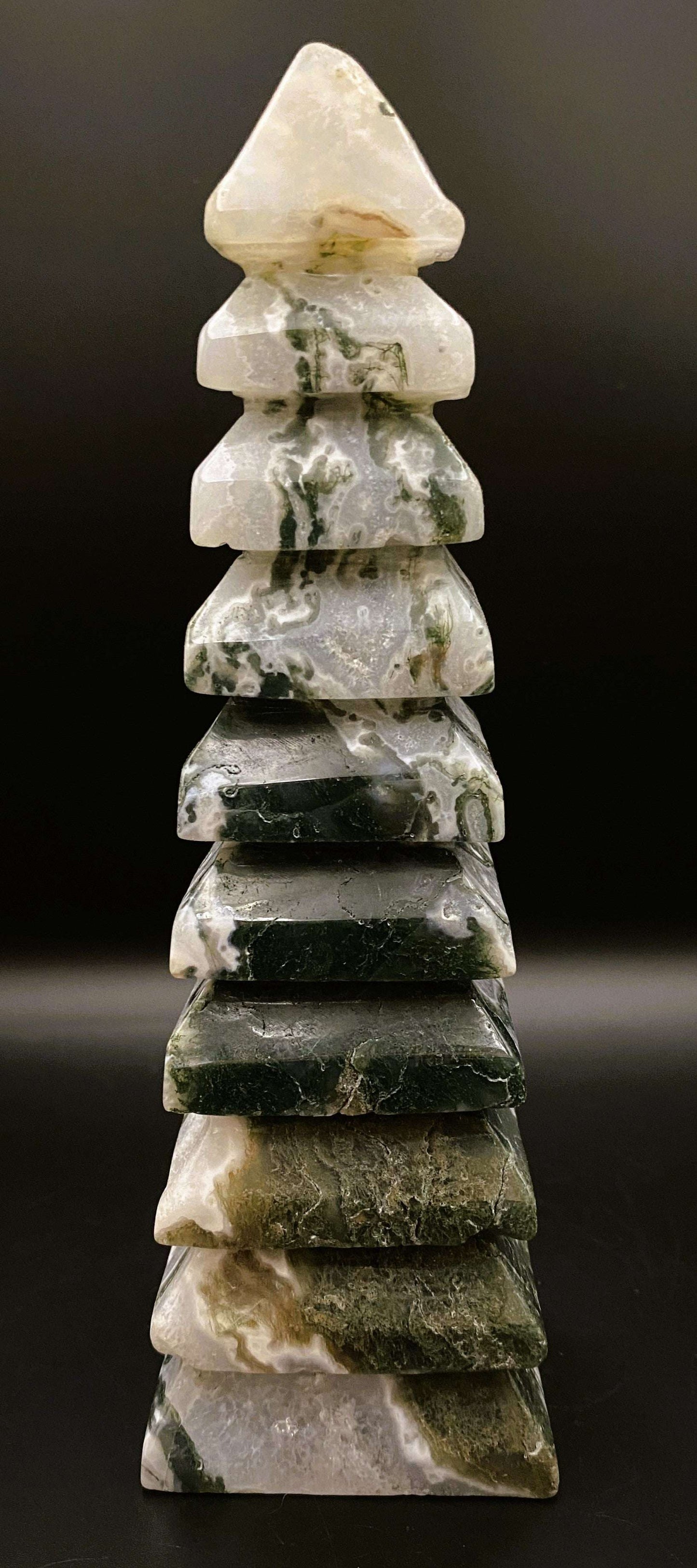 Turn pagoda sculpted from green and white Agat Muschi stone against black background