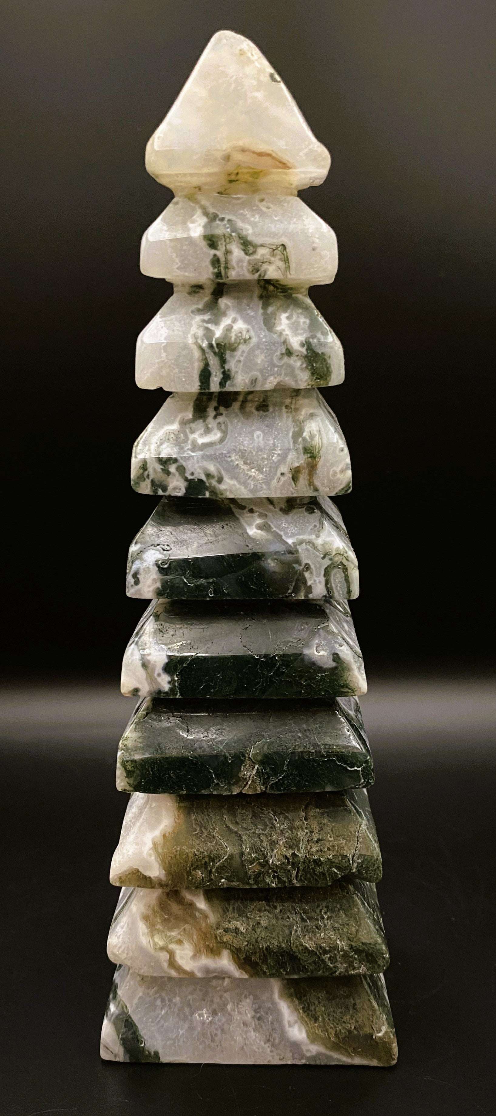 Turn pagoda sculpted from green and white Agat Muschi stone against black background