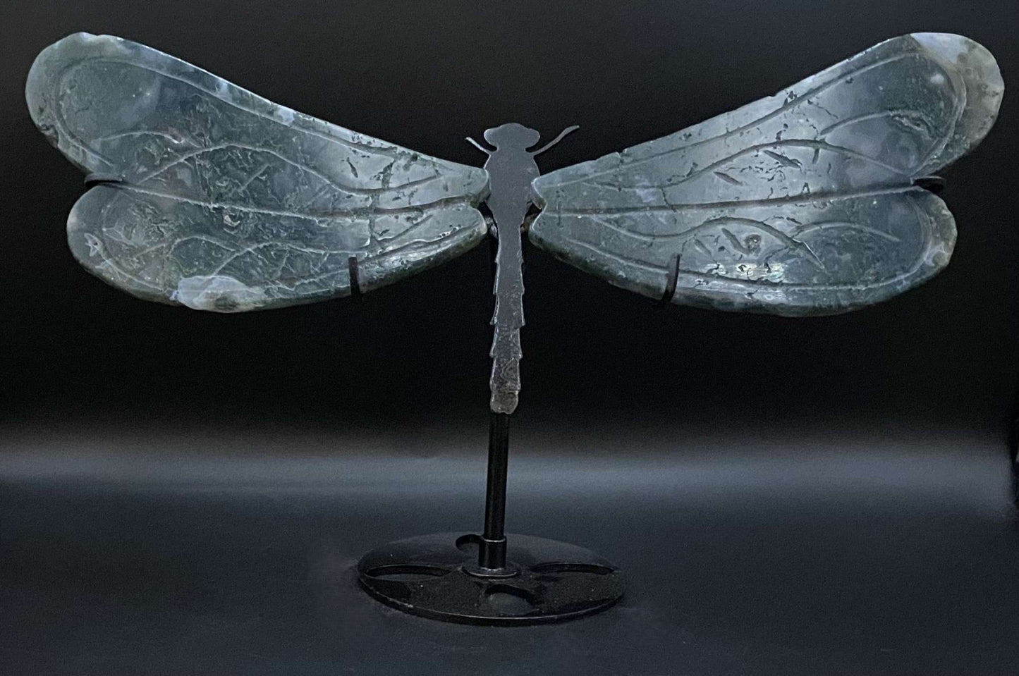 Dragonfly sculpture made from Agat Muschi gemstone on black metal stand
