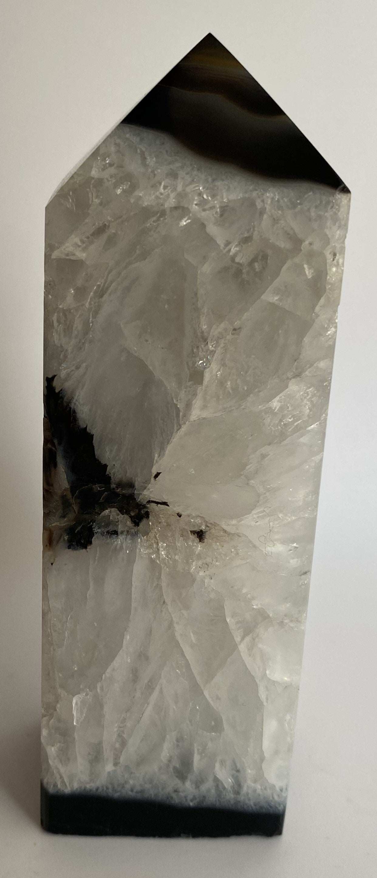Obelisk from black agate semiprecious stone with natural crystal patterns
