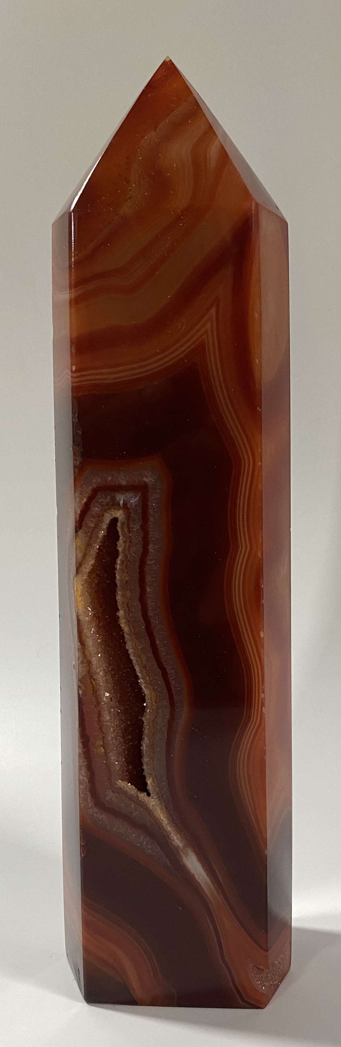 Obelisk made of polished red agate semiprecious stone with natural patterns