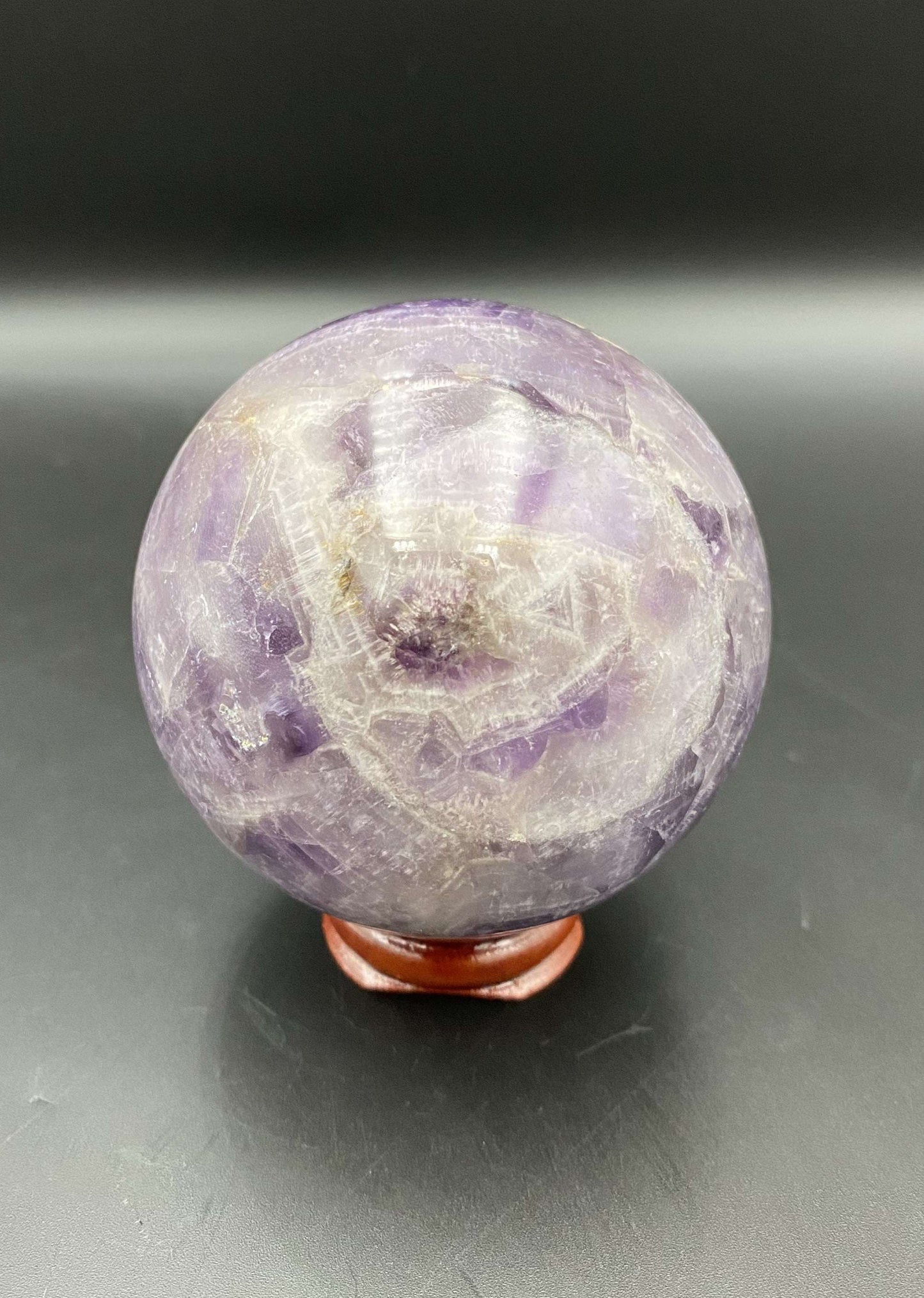Ametist Dream chevron sphere on wooden stand semi-precious gemstone