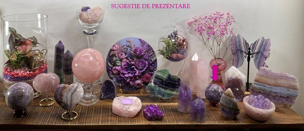 Ametist Dream chevron sphere semi-precious stone with wooden support displayed on wooden shelf among crystals and decorative flowers