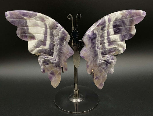 Butterfly sculpture made from Ametist Dream Chevron stone on metal stand