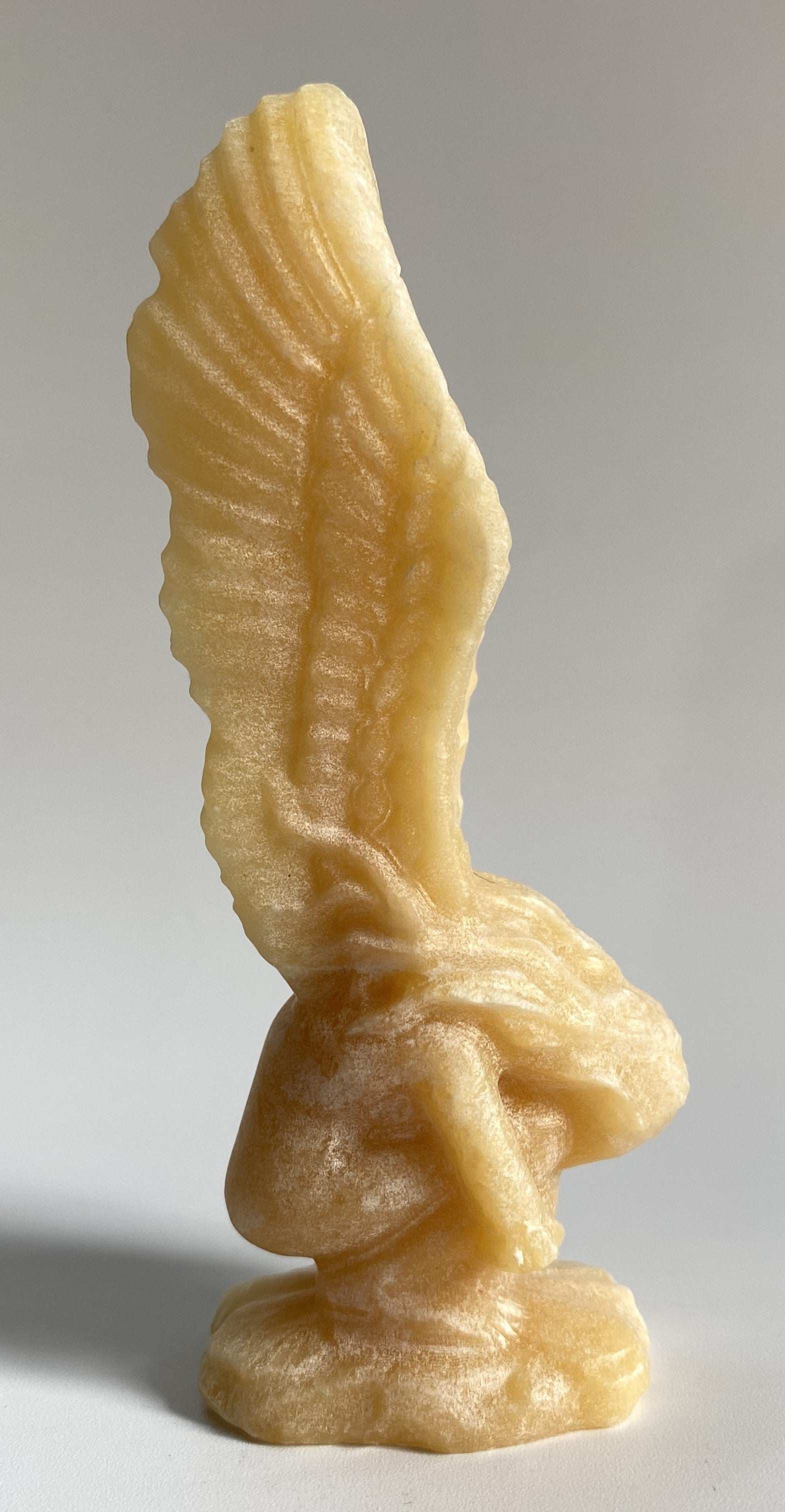 Yellow Calcit angel figurine carved from semiprecious stone