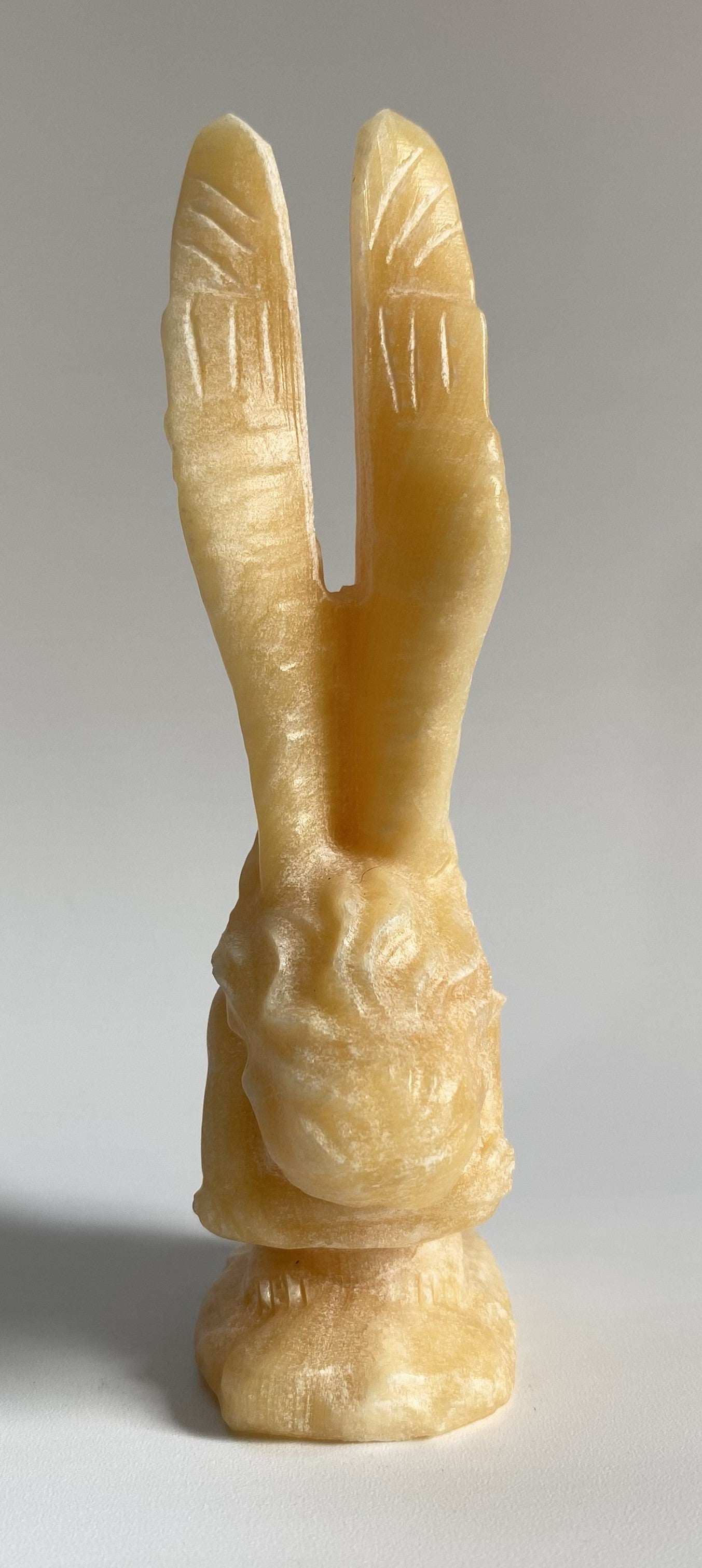 Yellow Calcit angel statue carved from semiprecious stone