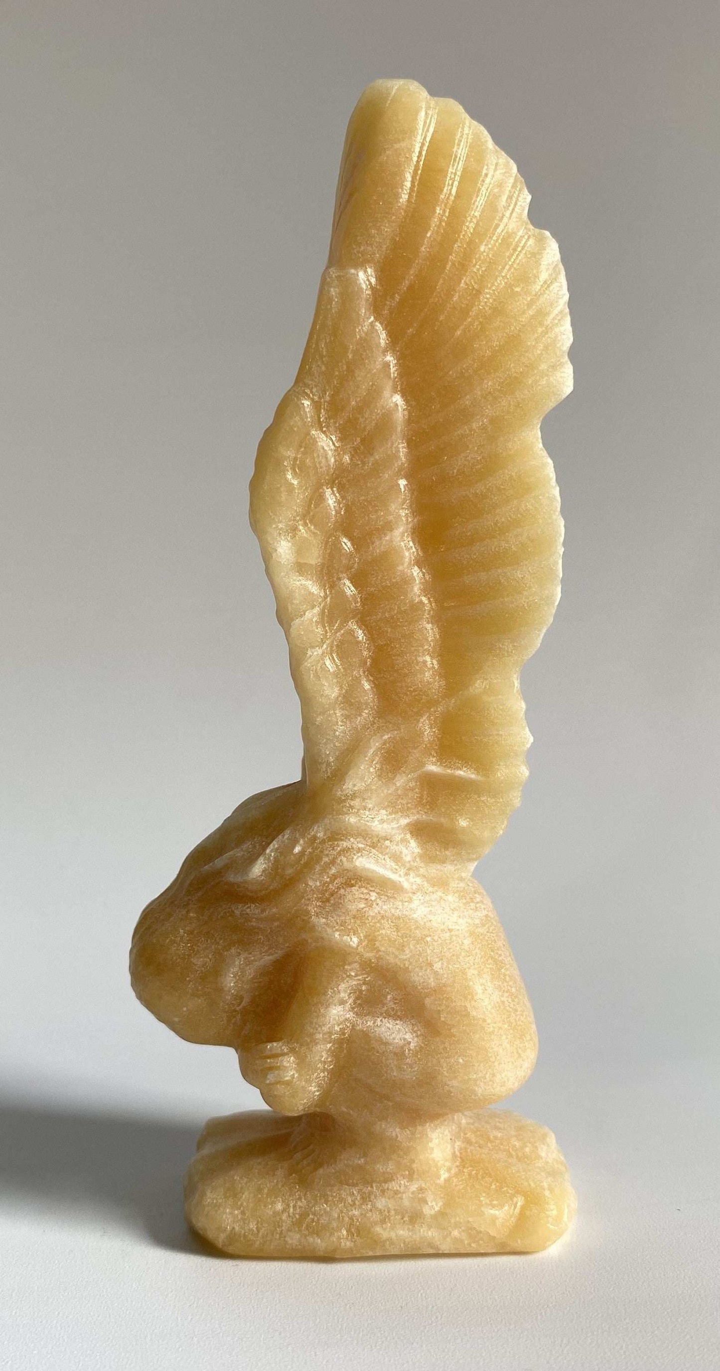 Yellow calcite angel figurine carved from semiprecious stone Calcit Galben