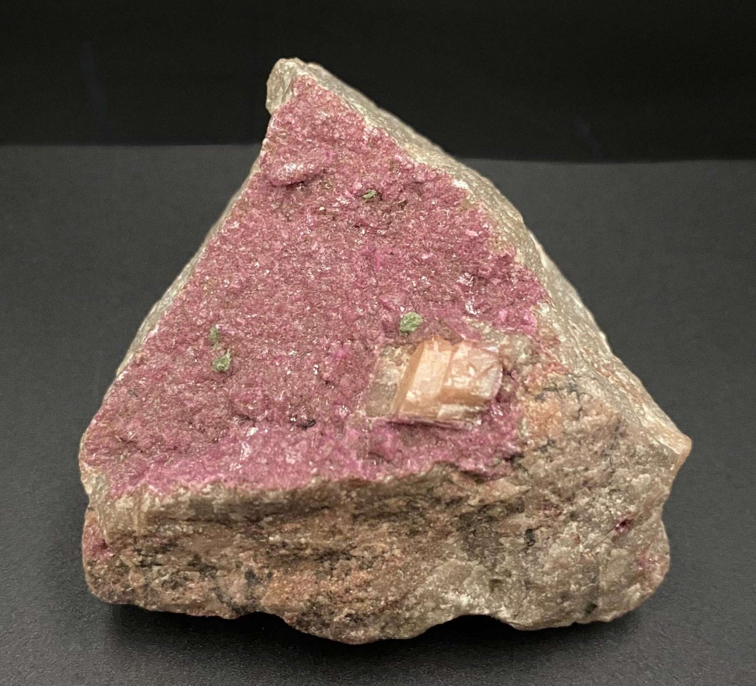 Cobaltocalcit semiprecious stone specimen with pink crystalline surface on rough base