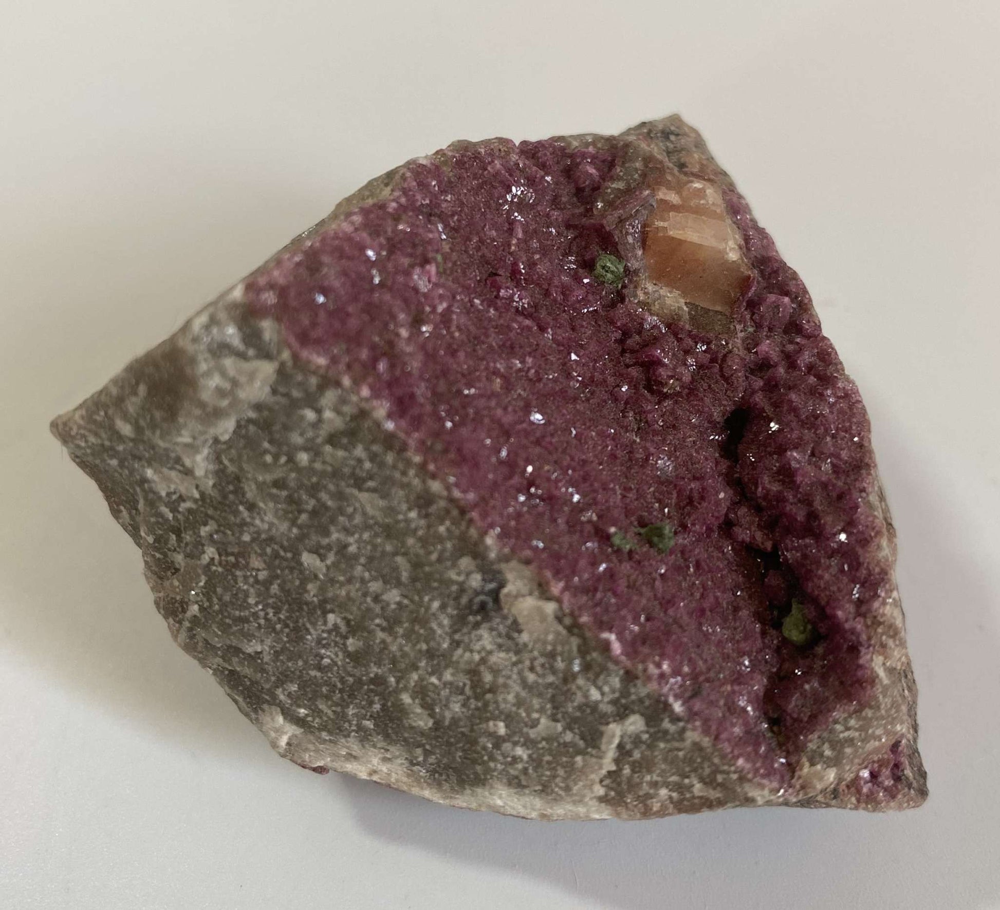 Cobaltocalcit semi-precious stone specimen with purple crystal formations on rough rock base