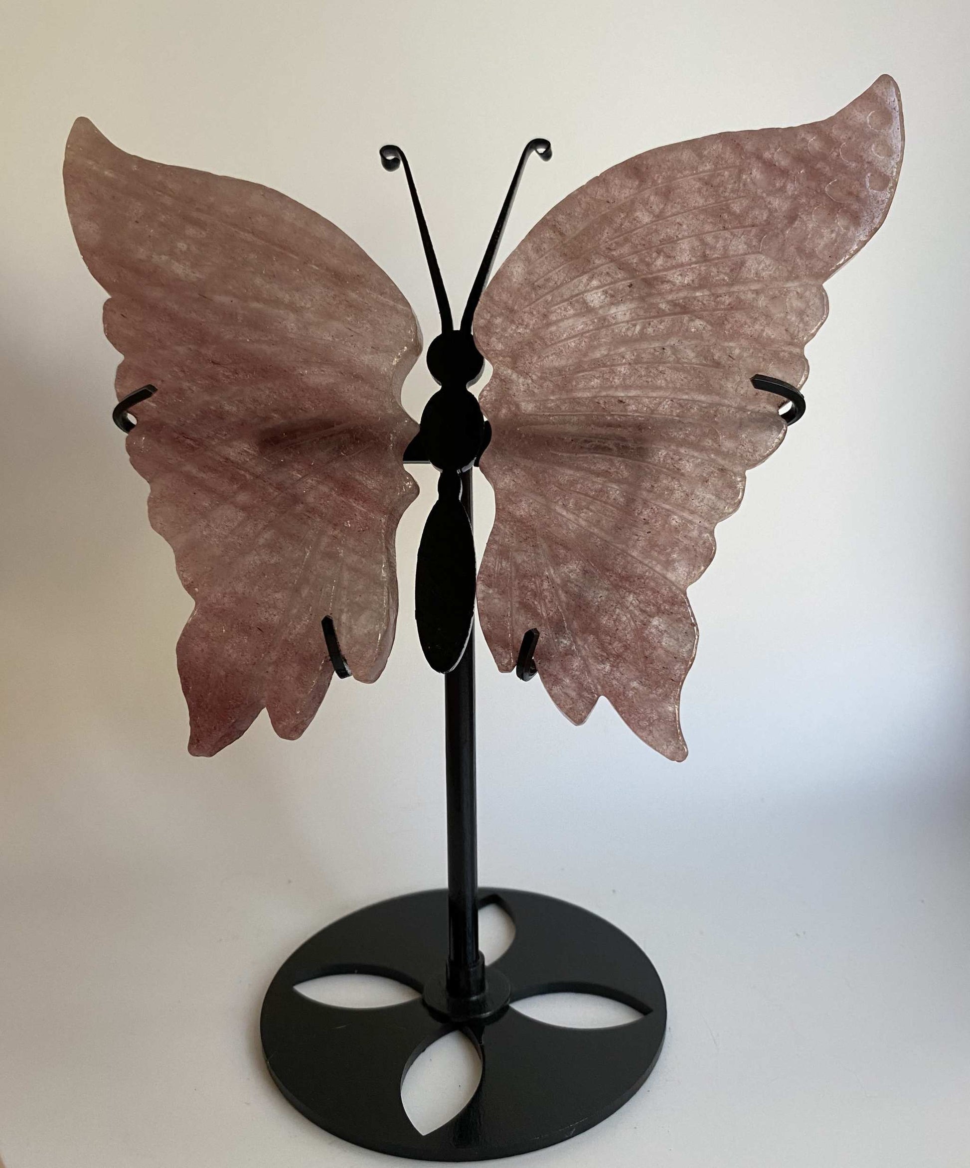 Butterfly sculpture made from Cuart Capsuna with metal stand included