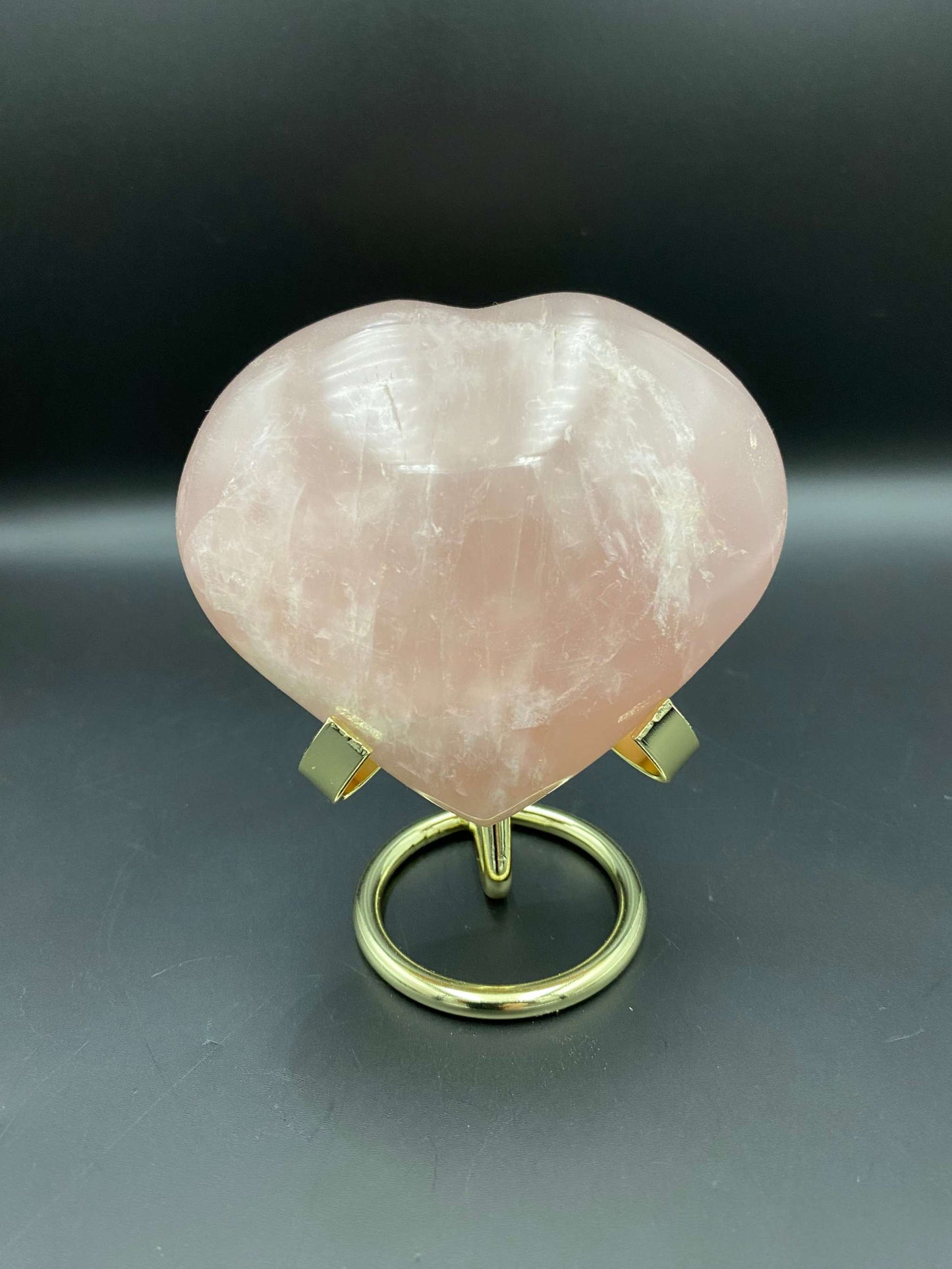Heart-shaped rose quartz gemstone on metal stand Cuart Roz semiprecious stone display