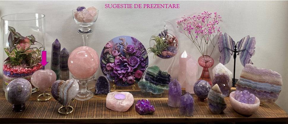 Cuart Roz heart-shaped semiprecious stone on metal stand displayed among crystals and flowers