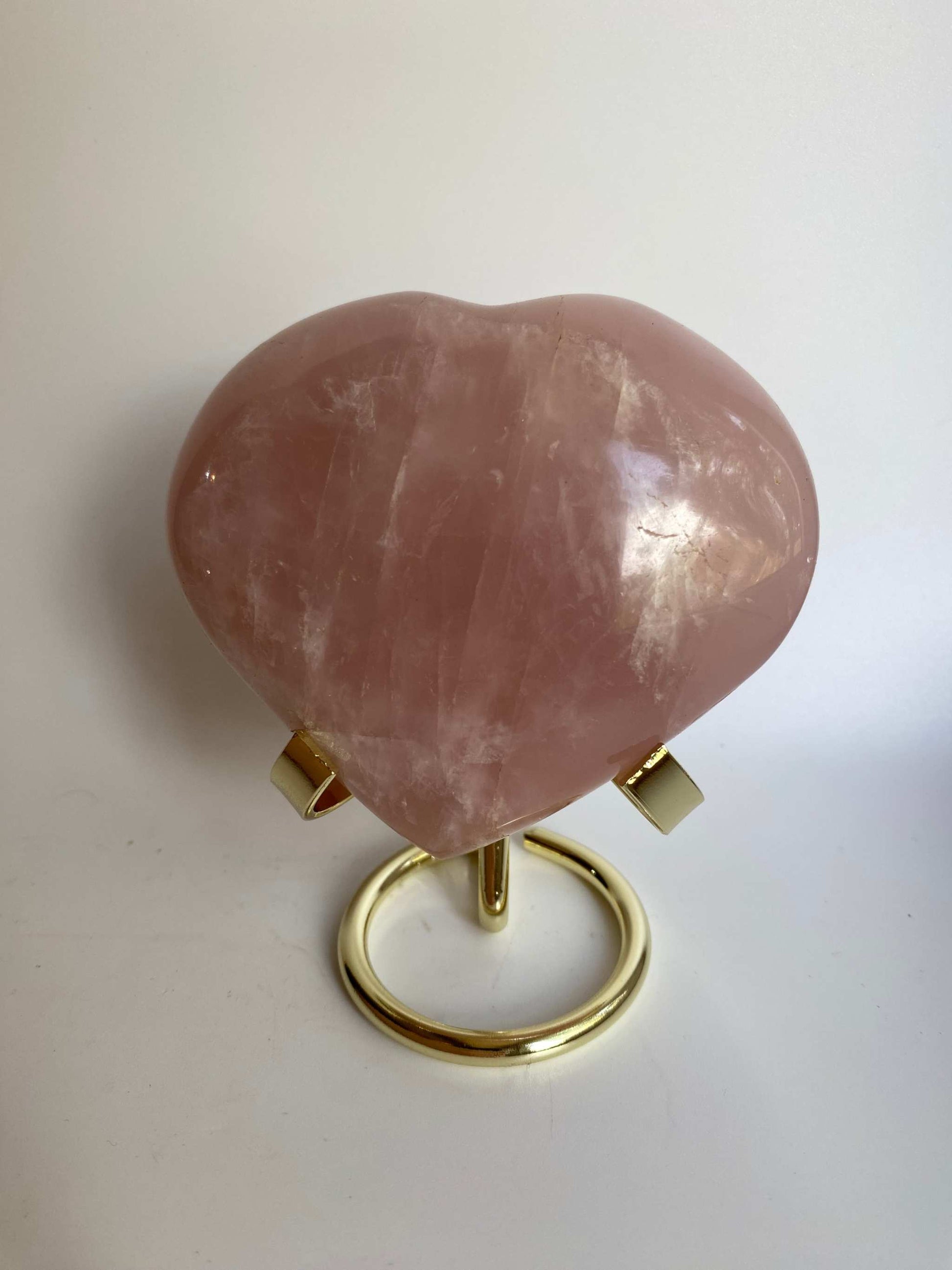Heart-shaped rose quartz gemstone on a metal stand Cuart Roz semi-precious stone