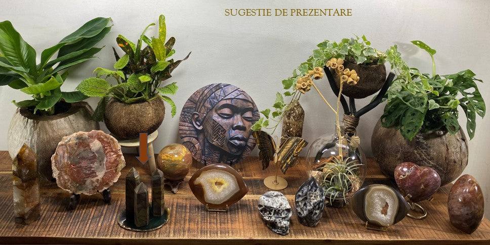 Set of three Jasp Bambus obelisks displayed on agate slice with decorative plants and stones.
