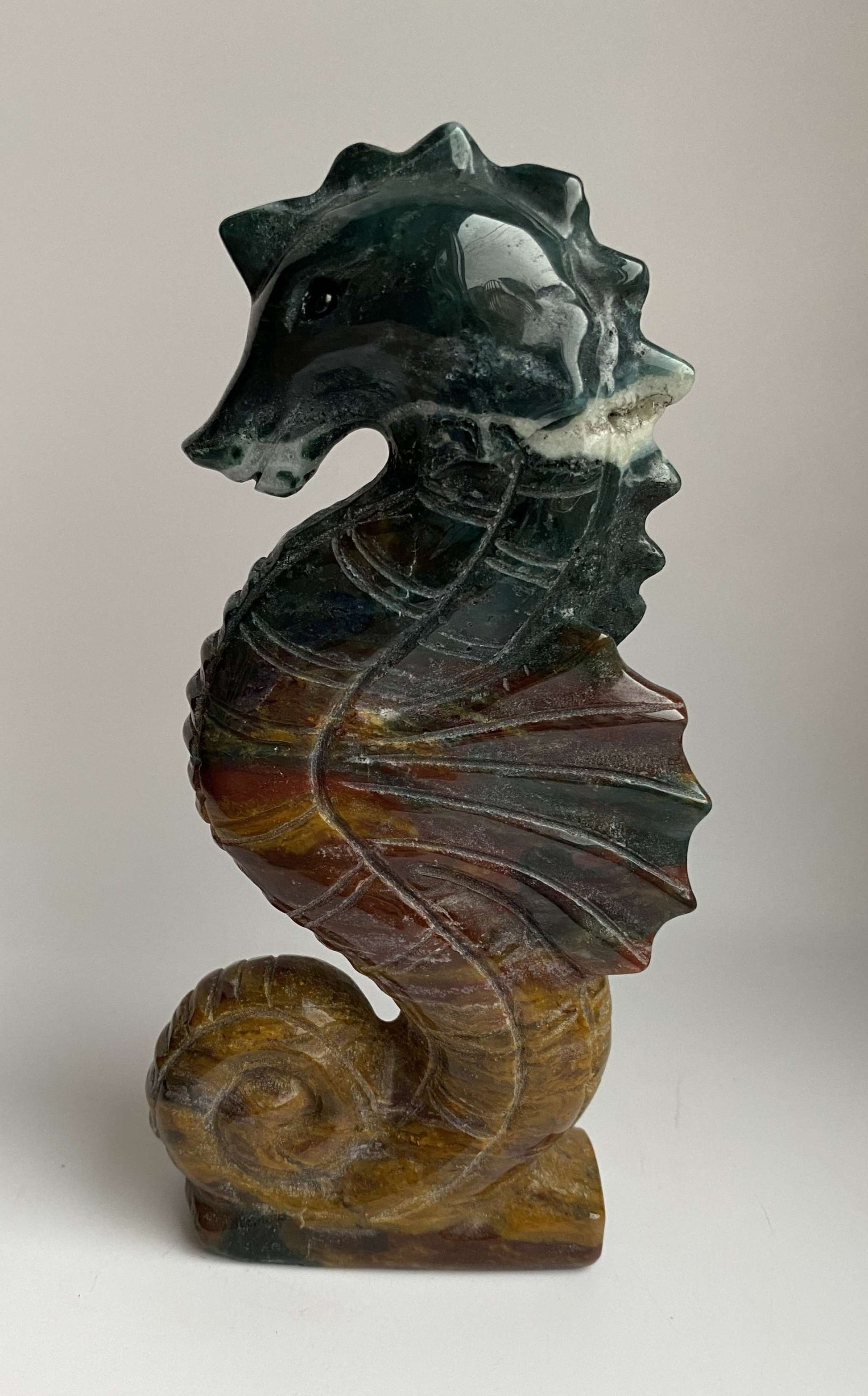 Jasp Oceanic carved seahorse gemstone sculpture with multicolor bands