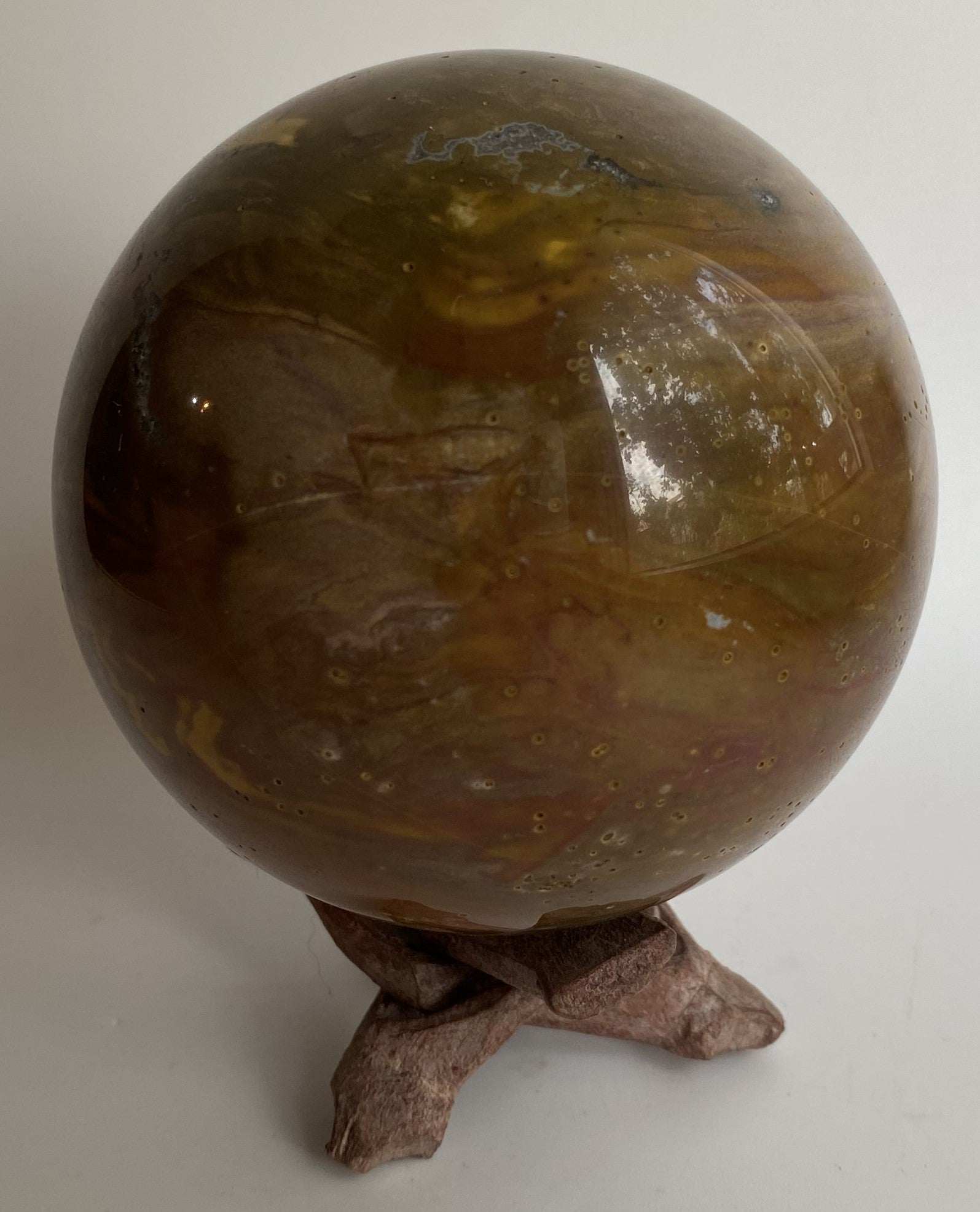 Jasp Oceanic semi-precious stone sphere on wooden stand