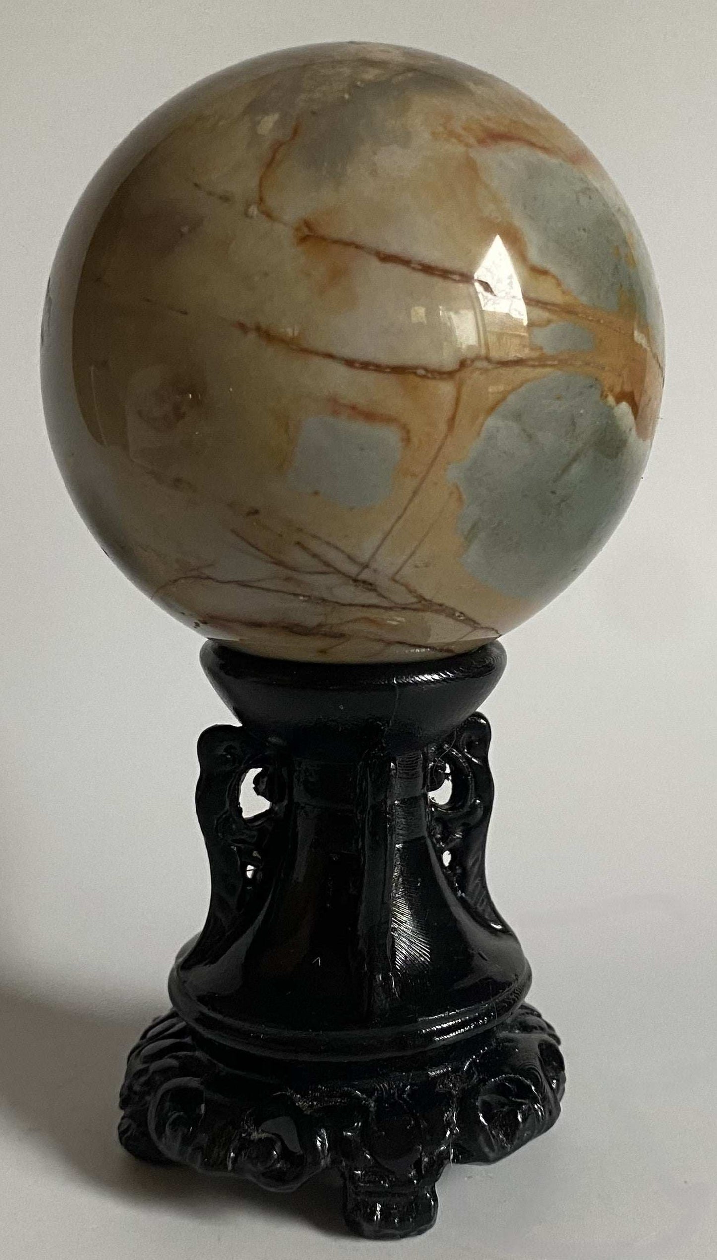 Sfera din Jasp Policrom de 6.3 cm pe suport sculptat negru din piatra semipretioasa naturala