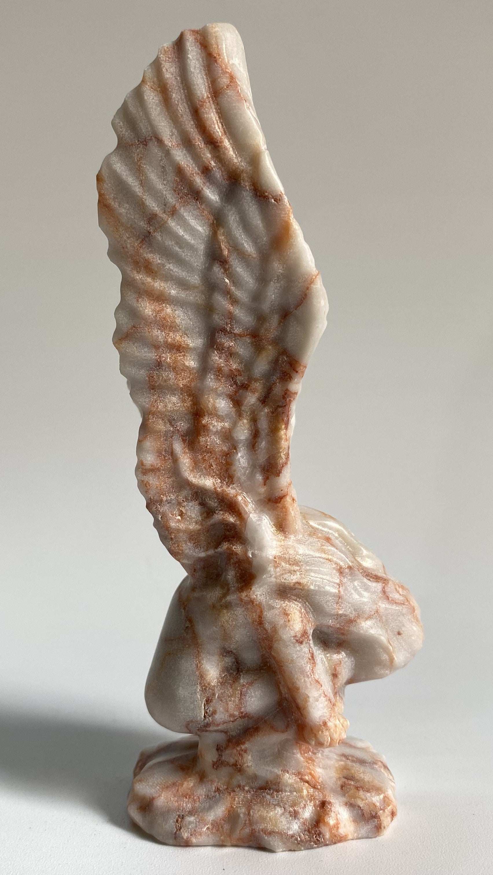Carved Jasp Red Vein angel figurine made from semi-precious stone