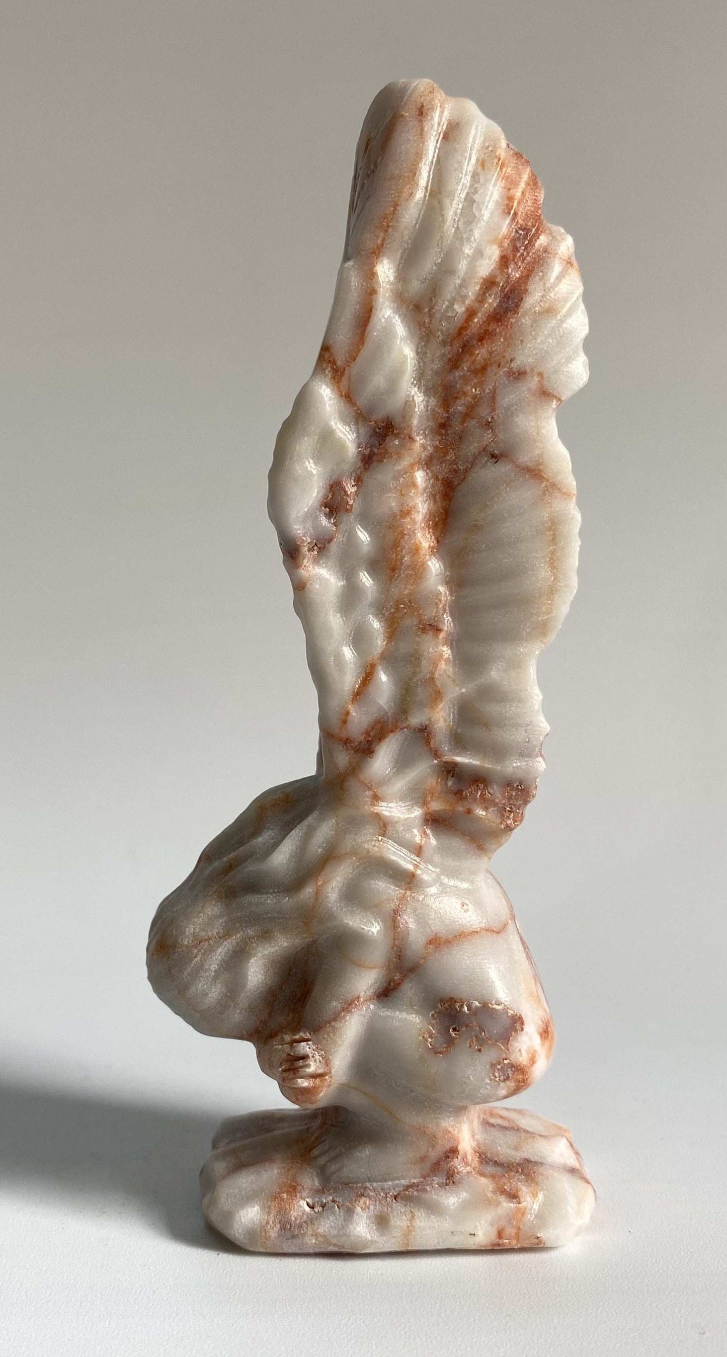 Jasp Red Vein angel figurine carved from semiprecious stone with red vein patterns