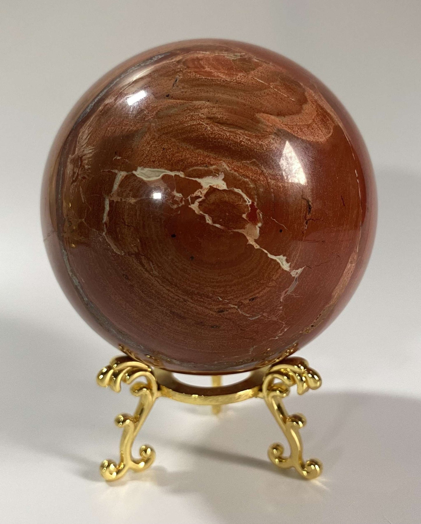 Jasp Rosu semiprecious stone sphere on a decorative metal stand