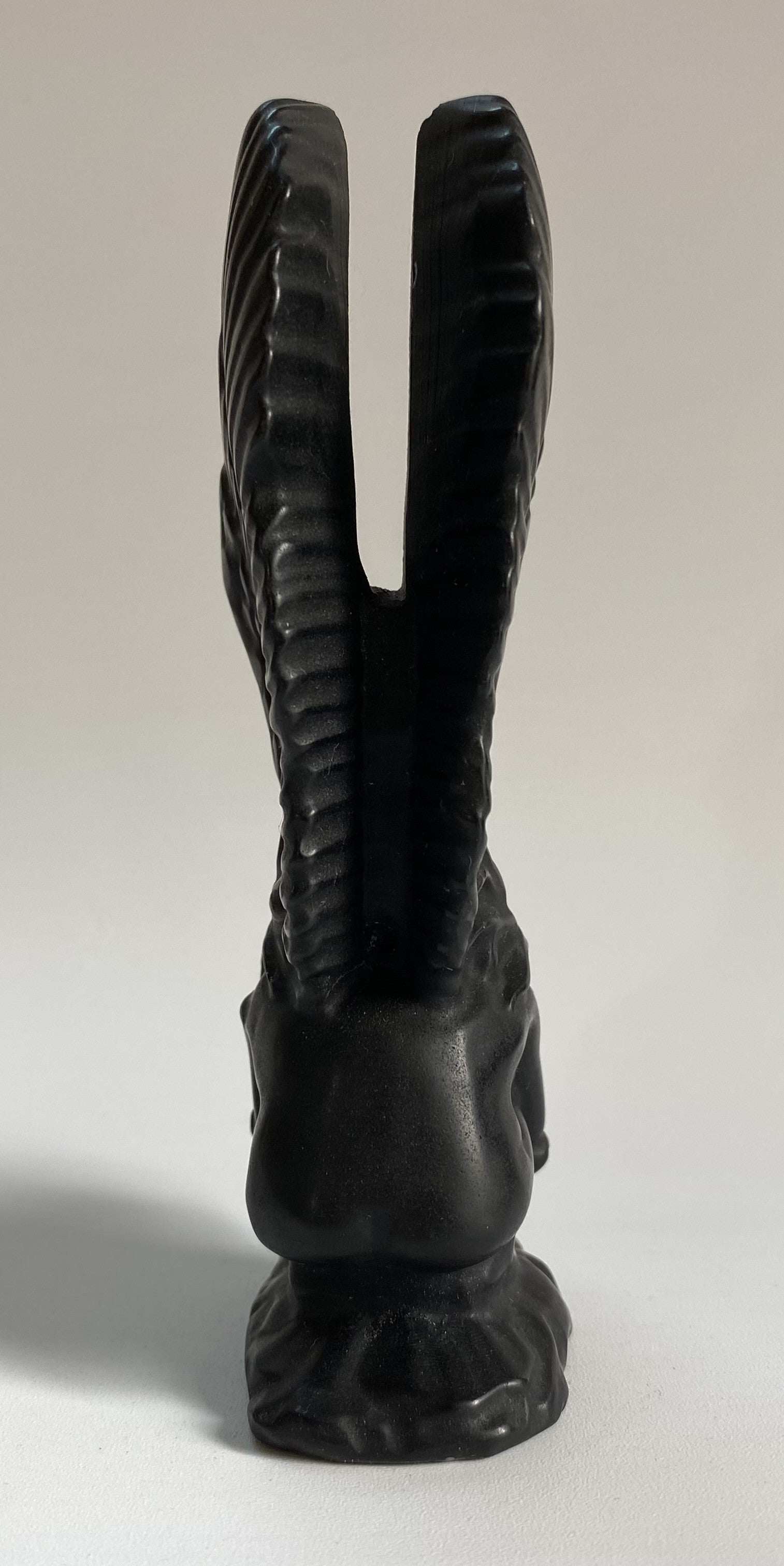 Carved obsidian angel figurine sculpture with detailed wings and base