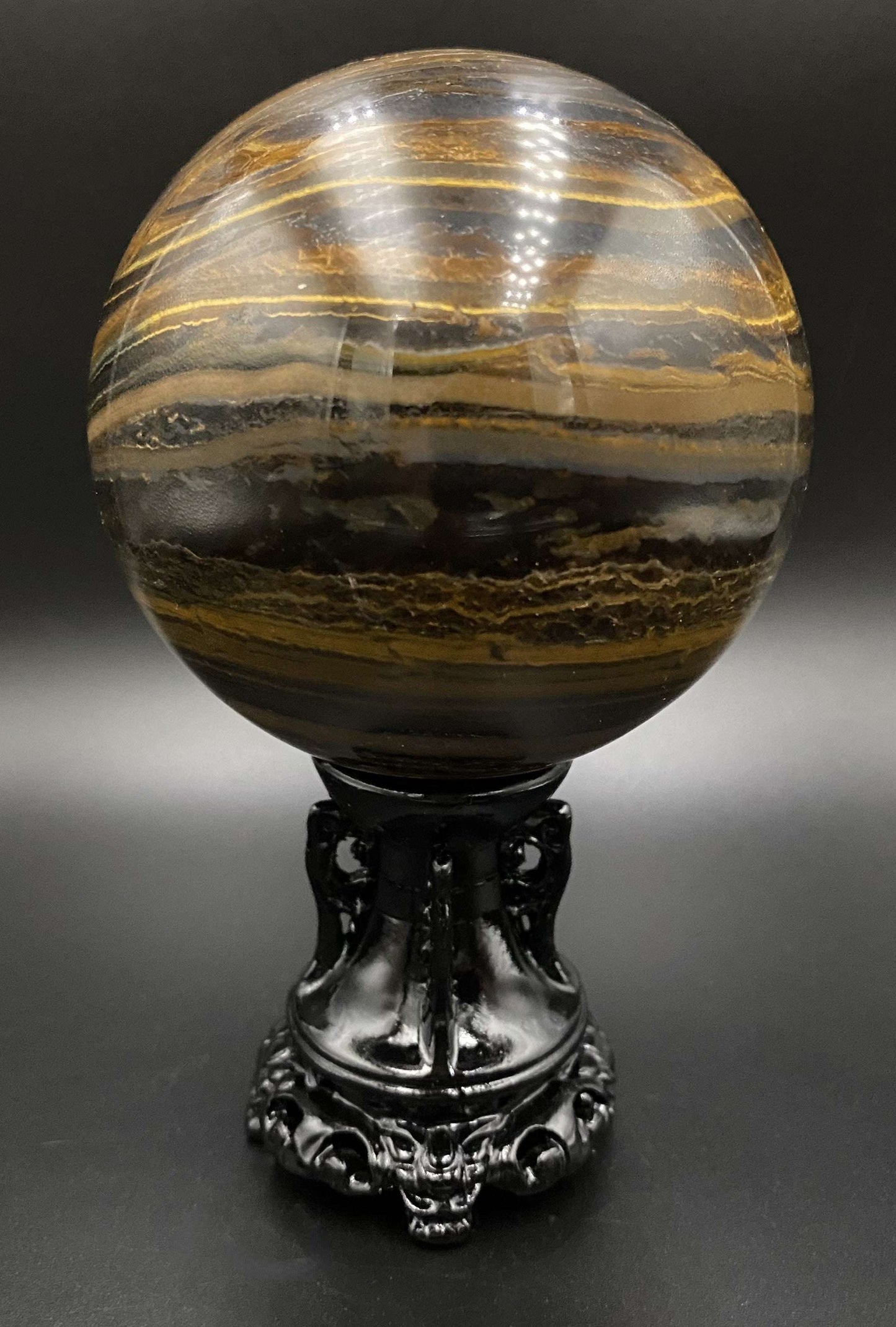 Ochi de Tigru cu Fier semiprecious stone sphere on black stand