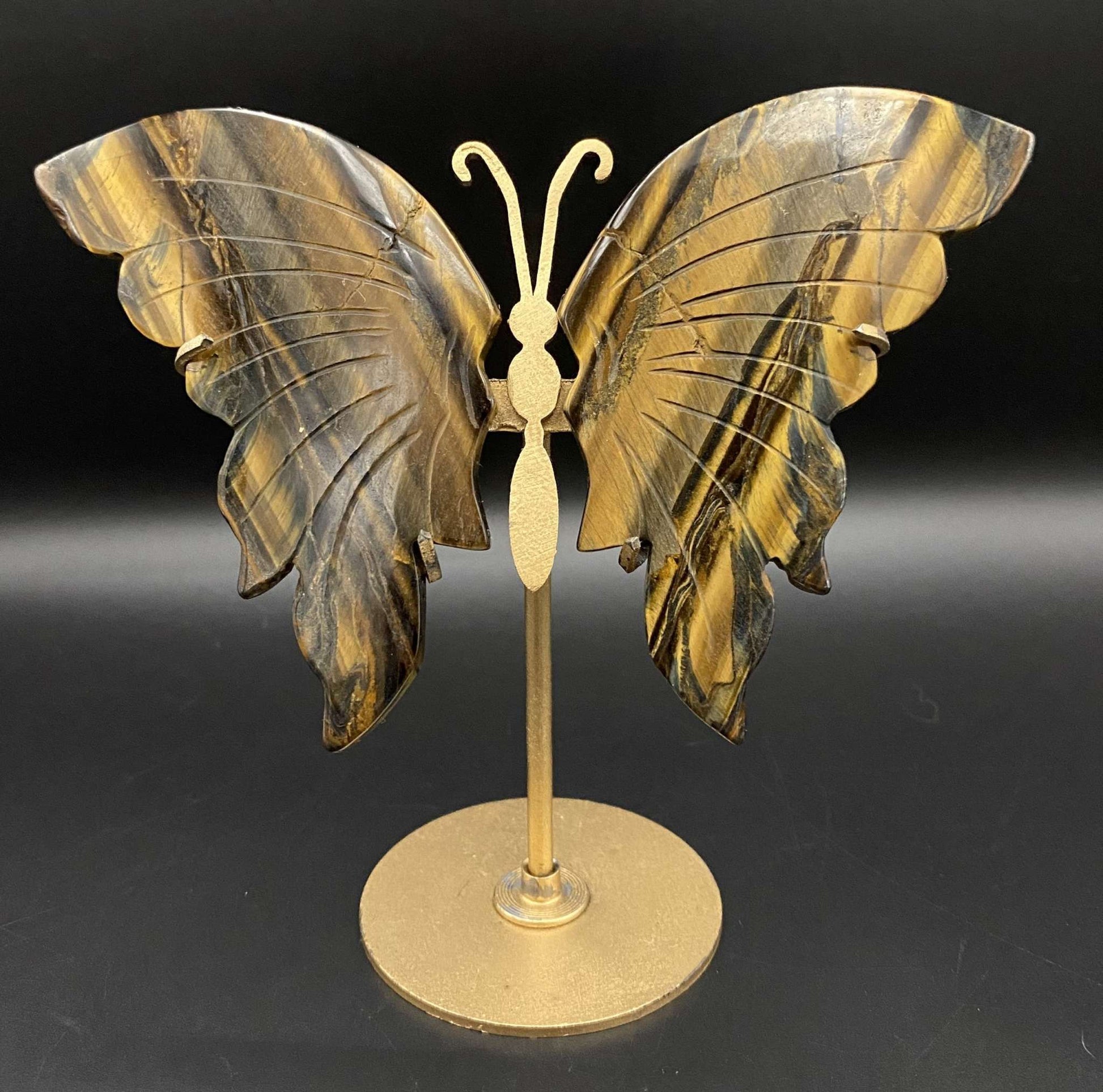 Butterfly sculpture made of Ochi de Tigru semi-precious stone on metal stand