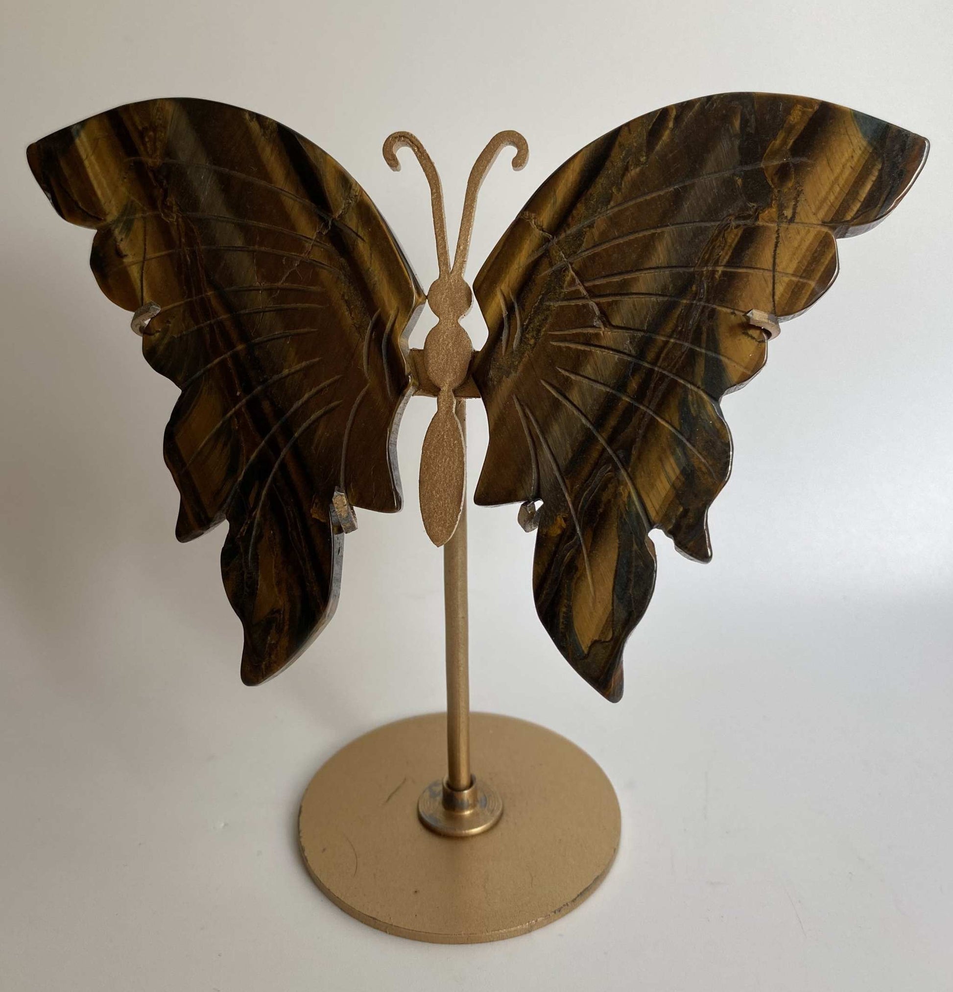 Butterfly sculpture made of Ochi de Tigru stone with metal stand