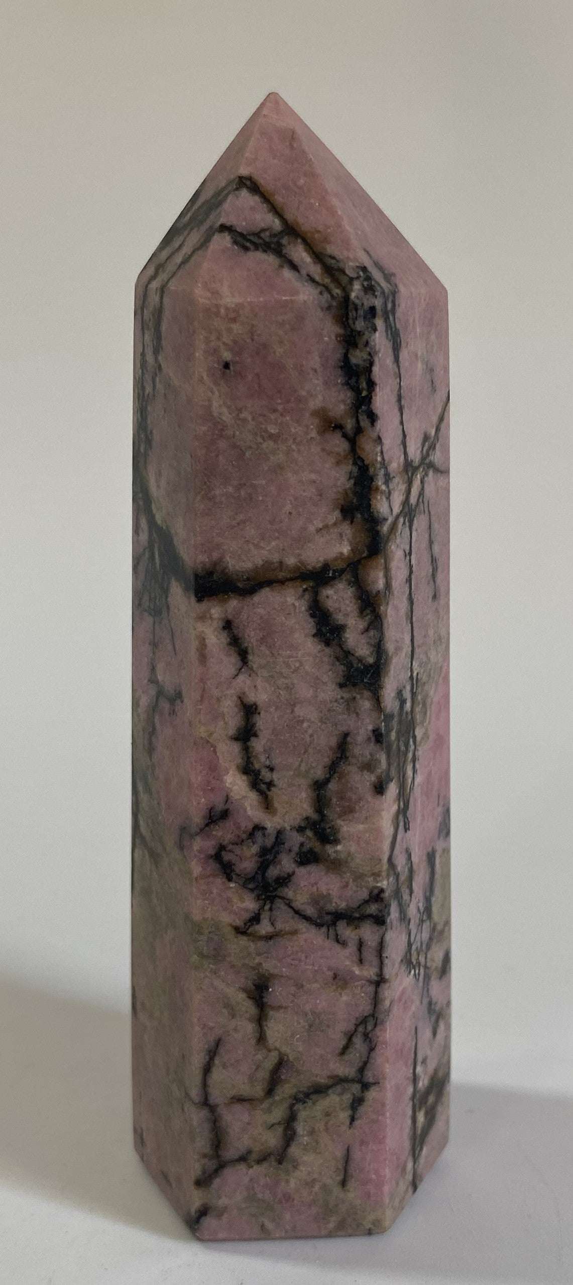 Rodonit obelisk stone with pink and black veining semi-precious gemstone sculpture